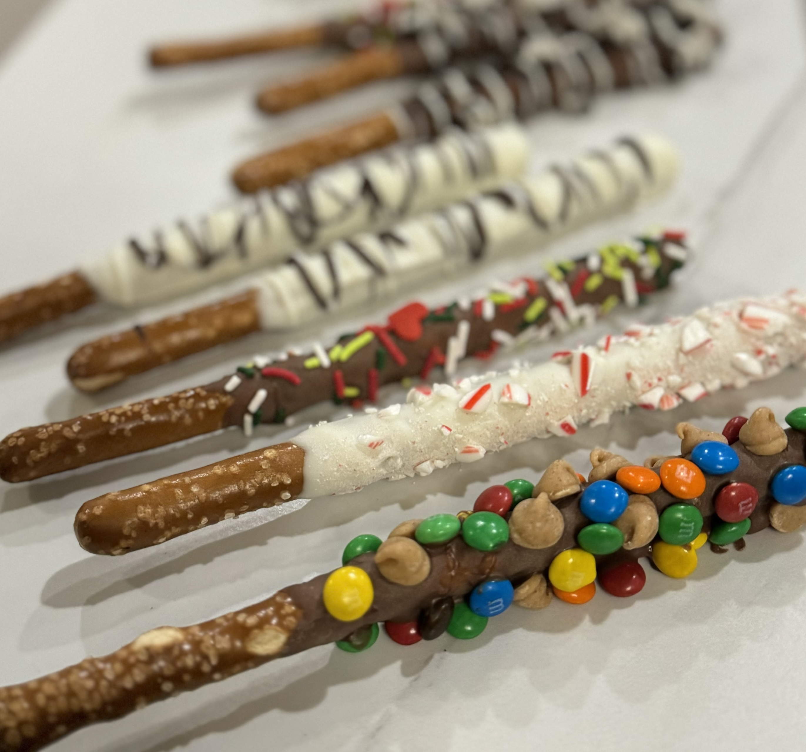 Chocolate covered pretzels with festive decorations